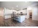 Bright kitchen with white cabinets, a spacious center island, and stainless steel appliances at 9256 Alden Pointe Ct, Las Vegas, NV 89143