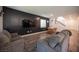 Open-concept living room features hardwood floors, neutral decor, and a modern staircase at 9256 Alden Pointe Ct, Las Vegas, NV 89143