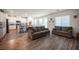 Spacious living room and kitchen combo features hardwood floors and lots of natural light at 9256 Alden Pointe Ct, Las Vegas, NV 89143