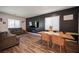 Cozy living space with stylish decor, including wood-look flooring and a modern entertainment center at 9256 Alden Pointe Ct, Las Vegas, NV 89143