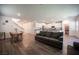 Open concept living room offers great views of the kitchen, dining area, and staircase at 9256 Alden Pointe Ct, Las Vegas, NV 89143