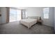 Spacious main bedroom with ensuite bathroom access, plush carpet, and ample natural light at 9256 Alden Pointe Ct, Las Vegas, NV 89143
