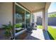 A covered patio shows an outdoor sitting area with a view of the landscaped backyard at 9256 Alden Pointe Ct, Las Vegas, NV 89143