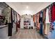 Spacious walk-in closet with ample storage and organized shelving for shoes and accessories at 9256 Alden Pointe Ct, Las Vegas, NV 89143