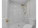 Bathroom featuring a marble-tiled shower, gold shower fixtures, and modern terrazzo-tiled floor at 9412 Mount Cherie Ave # 102, Las Vegas, NV 89129