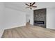 Open bedroom featuring sleek wood floors and a stylish modern fireplace feature at 9412 Mount Cherie Ave # 102, Las Vegas, NV 89129
