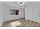 Bedroom with modern ceiling fan, wood-look floors, and a double closet at 9412 Mount Cherie Ave # 102, Las Vegas, NV 89129