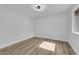 Bright bedroom with modern ceiling fan and light-colored wood-look floors at 9412 Mount Cherie Ave # 102, Las Vegas, NV 89129