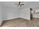 Spacious bedroom with ceiling fan and view into a bathroom with double vanity at 9412 Mount Cherie Ave # 102, Las Vegas, NV 89129