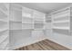 Walk-in closet with built-in shelves and drawers provides ample storage space in the home at 9412 Mount Cherie Ave # 102, Las Vegas, NV 89129