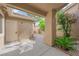 View of side courtyard with drought-tolerant landscaping and a small palm tree at 9412 Mount Cherie Ave # 102, Las Vegas, NV 89129