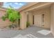 Covered front entry featuring a desert landscape with a gray stone walkway at 9412 Mount Cherie Ave # 102, Las Vegas, NV 89129
