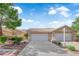 Charming single-story home with a tile roof and well-manicured landscaping at 9412 Mount Cherie Ave # 102, Las Vegas, NV 89129