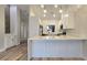 Bright kitchen with quartz countertops, white cabinets, and stainless steel appliances at 9412 Mount Cherie Ave # 102, Las Vegas, NV 89129