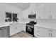 Bright Kitchen featuring stainless steel appliances, white cabinets and quartz countertops at 9412 Mount Cherie Ave # 102, Las Vegas, NV 89129