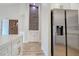 Open kitchen design flows into living area, highlighted by a stainless refrigerator at 9412 Mount Cherie Ave # 102, Las Vegas, NV 89129