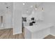 Bright kitchen with quartz countertops, white cabinetry and stainless steel appliances at 9412 Mount Cherie Ave # 102, Las Vegas, NV 89129