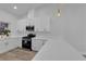 Kitchen featuring white cabinets, quartz countertops, and stainless steel appliances at 9412 Mount Cherie Ave # 102, Las Vegas, NV 89129