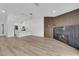 Open-concept living space with fireplace and seamless connection to the contemporary kitchen at 9412 Mount Cherie Ave # 102, Las Vegas, NV 89129
