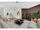 Bright, inviting living room boasts a fireplace and flows into a modern, stylish kitchen at 9412 Mount Cherie Ave # 102, Las Vegas, NV 89129
