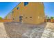 The backyard includes grass, a sliding glass door to the home, and a fence at 9712 Rocket Grove Ct, Las Vegas, NV 89178