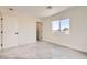 Simple bedroom with a neutral palette, carpet, and window, perfect for relaxation at 9712 Rocket Grove Ct, Las Vegas, NV 89178