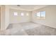 Spacious bedroom with ample natural light and neutral carpeting at 9712 Rocket Grove Ct, Las Vegas, NV 89178