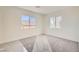 Bright bedroom with carpet, offering natural light and views of the neighborhood at 9712 Rocket Grove Ct, Las Vegas, NV 89178