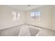 Light-filled bedroom with plush carpet and dual windows, ready for personalization at 9712 Rocket Grove Ct, Las Vegas, NV 89178