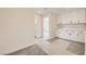 Spacious bonus room with white built-in cabinets and soft, patterned carpeting at 9712 Rocket Grove Ct, Las Vegas, NV 89178