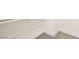 A corner of a room features white walls and trim, with gray carpet at 9712 Rocket Grove Ct, Las Vegas, NV 89178
