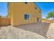 A two story home with a walk-out basement, windows, and a fenced backyard at 9712 Rocket Grove Ct, Las Vegas, NV 89178