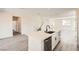 Well-lit kitchen features modern stainless steel appliances, a kitchen island, and an open floor plan at 9712 Rocket Grove Ct, Las Vegas, NV 89178