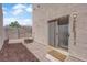 Backyard with sliding glass door, rock area, and exterior access with a small step at 9957 Fine Fern St, Las Vegas, NV 89183