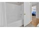 Bright bathroom features a bathtub shower combination at 9957 Fine Fern St, Las Vegas, NV 89183
