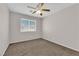 Neutral bedroom with carpet, a ceiling fan, and a bright window at 9957 Fine Fern St, Las Vegas, NV 89183