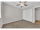 Spacious bedroom featuring carpet floors, a ceiling fan, and a closet at 9957 Fine Fern St, Las Vegas, NV 89183