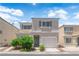 Charming two-story home with stucco exterior, manicured landscaping, and attached one car garage at 9957 Fine Fern St, Las Vegas, NV 89183