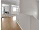 Bright hallway featuring hardwood floors with views of bedrooms at 9957 Fine Fern St, Las Vegas, NV 89183