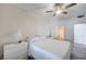 Bedroom featuring neutral colors, a ceiling fan, and an ensuite bathroom with a shower and toilet at 9975 Peace Way # 1024, Las Vegas, NV 89147
