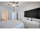 A bright bedroom featuring a ceiling fan, closet, dresser, and attached bathroom with a shower and toilet at 9975 Peace Way # 1024, Las Vegas, NV 89147