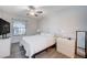 Bedroom with white furnishings, a ceiling fan, a window, and light gray flooring at 9975 Peace Way # 1024, Las Vegas, NV 89147
