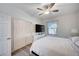 Bedroom features include a ceiling fan, a window, a dresser with a TV, and a closet with sliding doors at 9975 Peace Way # 1024, Las Vegas, NV 89147