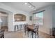 Cozy dining area next to a pass through to kitchen with a neutral color palette at 9975 Peace Way # 1024, Las Vegas, NV 89147