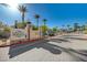 Community entrance with 'Chateau Nouveau' sign and mature landscaping at 9975 Peace Way # 1024, Las Vegas, NV 89147