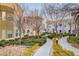 Inviting condo community with lush landscaping and walking paths on a sunny day at 9975 Peace Way # 1024, Las Vegas, NV 89147