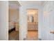 Bright hallway view showcasing an open bedroom and bathroom layout with neutral tones and modern finishes at 9975 Peace Way # 1024, Las Vegas, NV 89147