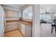 Well-lit kitchen with neutral cabinets, tile floors, and stainless-steel appliances at 9975 Peace Way # 1024, Las Vegas, NV 89147