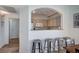 View to kitchen featuring painted cabinets, breakfast bar, and lots of natural light at 9975 Peace Way # 1024, Las Vegas, NV 89147