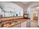 Kitchen featuring a stainless steel sink, appliances, and a pass through to the living room at 9975 Peace Way # 1024, Las Vegas, NV 89147